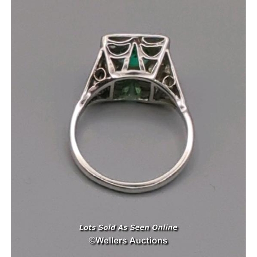 311 - Antique ring of Art Deco design, the central cushion cut emerald surrounded by old cut diamonds pave... 