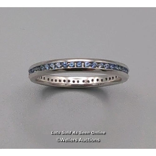 315 - Full eternity ring comprising round cut sapphires channel set in 18ct white gold. Width 2.6mm, ring ... 