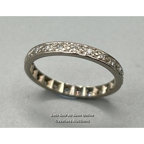 317 - Diamond set full eternity ring in white metal testing as 18ct gold, estimated diamond weight 0.20ct.... 