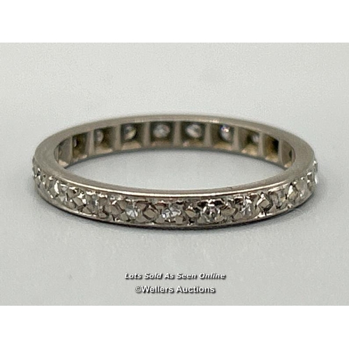 317 - Diamond set full eternity ring in white metal testing as 18ct gold, estimated diamond weight 0.20ct.... 