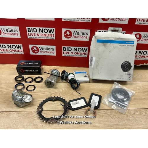 80 - MIXED LOT OF ASSORTED BICYCLE COMPONENTS INCL. SHIMANO CASSETTE SPROCKET, MEGAEVO BOTTOM BRACKET & P... 