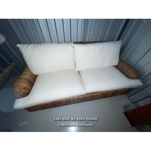 101 - Two seater wicker lounge with cushions, covers will need a clean, 78cm h x 186cm w x 90cm d / contai... 