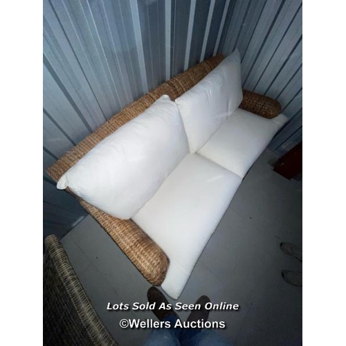 101 - Two seater wicker lounge with cushions, covers will need a clean, 78cm h x 186cm w x 90cm d / contai... 