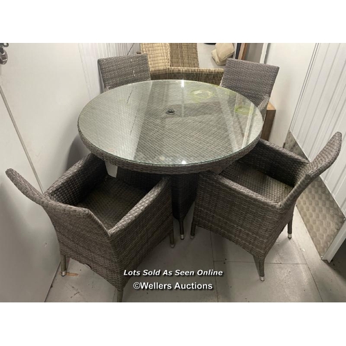 102 - Rattan suite including glass top circular table and four chairs, without cushions, table measures, 7... 