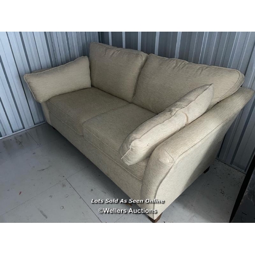 110 - Two seater upholstered cream colored sofa, cushions will need a clean, 95cm h x 180cm w x 100cm d / ... 