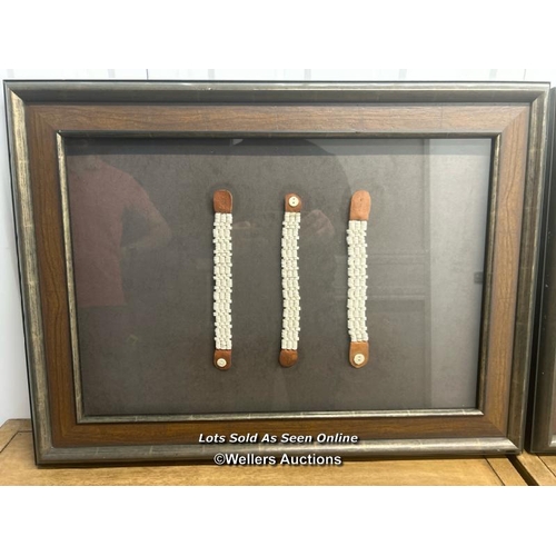 41 - Two framed and glazed traditional african bracelets and  necklaces, 52cm h x 68cm w / container no: ... 