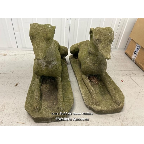 67 - Pair of recumbent stone greyhounds, 70cm l x 42cm h / container no: s207 / titan storage solutions, ... 