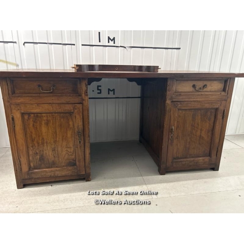 85 - Large oak desk, front support damaged and requires restoration, 79cm h x 165cm w x 80cm d / containe... 