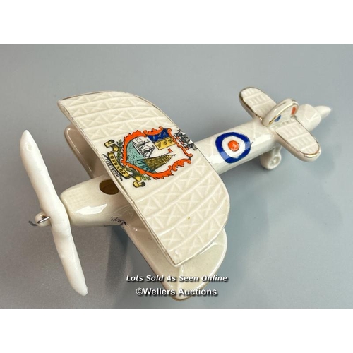 49 - Crested china charabanc no.7734 and Carlton ware twin wing fighter plane (2) / AN8