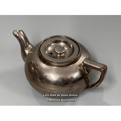 62 - A part unusual pottery tea & coffee service with metallic coating. The interior of the sugar bowl te... 