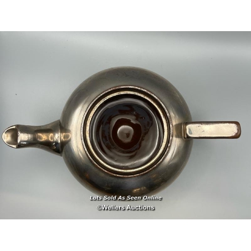 62 - A part unusual pottery tea & coffee service with metallic coating. The interior of the sugar bowl te... 