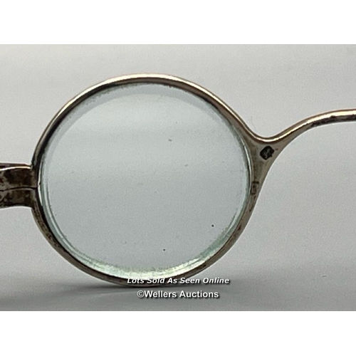 67 - A pair of antique silver folding eyeglasses in leather case, 10.5cm wide, total weight 21g / AN12