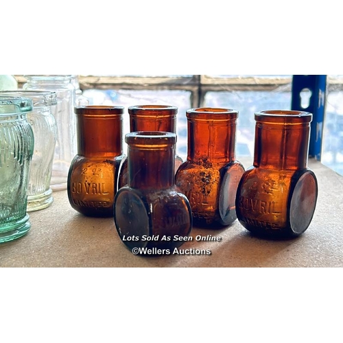 73 - A very large collection of assorted vintage glass bottles and jars including R Whites, Bovril, Carlt... 