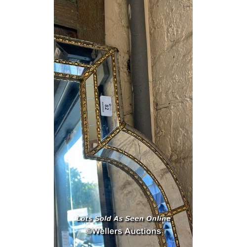 82 - A very large wall hanging mirror with ornate frame, 200 x 110cm