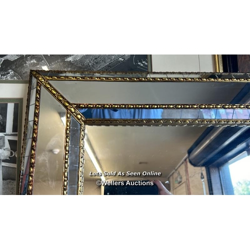 82 - A very large wall hanging mirror with ornate frame, 200 x 110cm