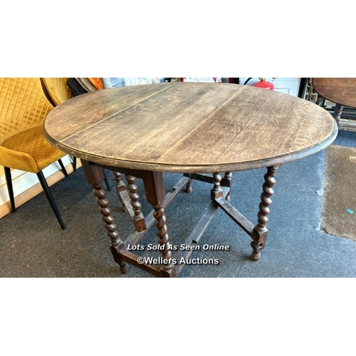 84 - Antique drop leaf table on twisted supports, table top 120 x 89cm (open), 73cm high