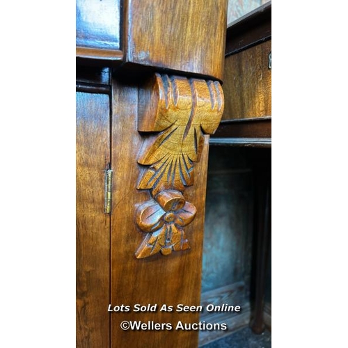 86 - Antique bow front cabinet with one drawer over two doors and carved finials, with key but lock not w... 