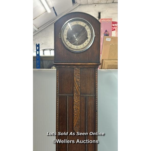 103 - Oak cased Grandmother clock with carved decoration, 13cm clock face, 129 x 28 x 5cm, damaged glass, ... 