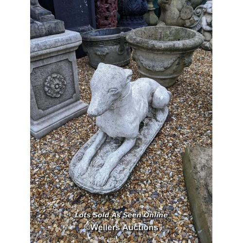 82 - a0078 Reconstituted stone laying whippet, H:39cm x W:65cm