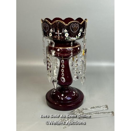 138 - A victorian ruby red mantle lustre with crystal drops, and some spares, 35.5cm high / AN19