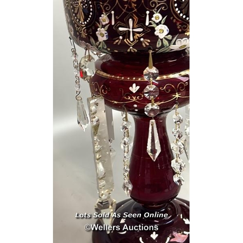 138 - A victorian ruby red mantle lustre with crystal drops, and some spares, 35.5cm high / AN19