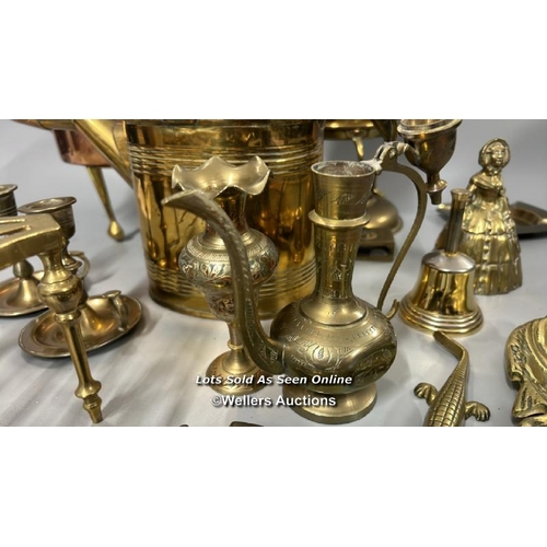 181 - Brass and copperware including large copper teapot, candle holders and decorative items / AN27