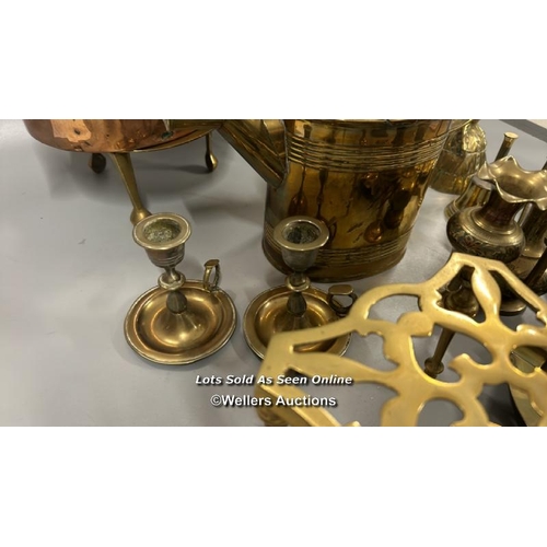 181 - Brass and copperware including large copper teapot, candle holders and decorative items / AN27