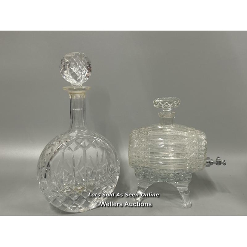 183 - Two cut glass decanters including a barrel on glass stand, and a circular based decanter, tallest 32... 