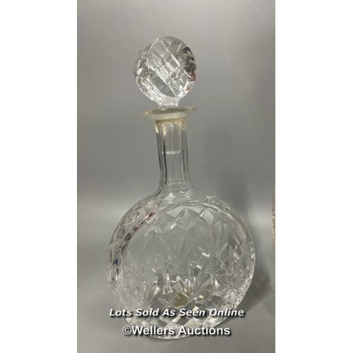 183 - Two cut glass decanters including a barrel on glass stand, and a circular based decanter, tallest 32... 