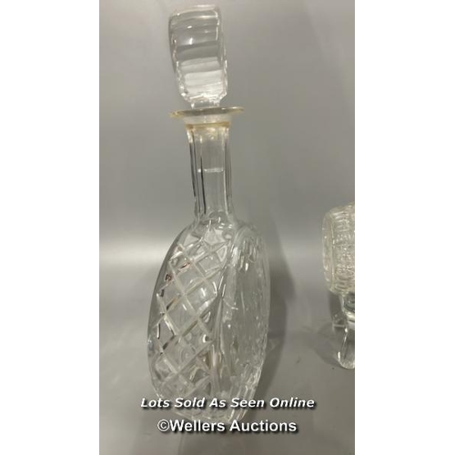 183 - Two cut glass decanters including a barrel on glass stand, and a circular based decanter, tallest 32... 