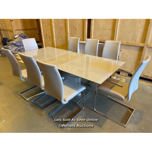 42 - Modern boardroom style dining table with three detatchable glass leaves and eight faux leather uphol... 