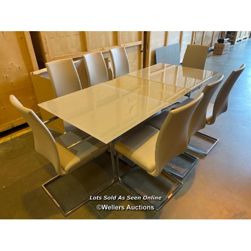 42 - Modern boardroom style dining table with three detatchable glass leaves and eight faux leather uphol... 