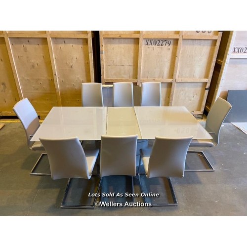 42 - Modern boardroom style dining table with three detatchable glass leaves and eight faux leather uphol... 