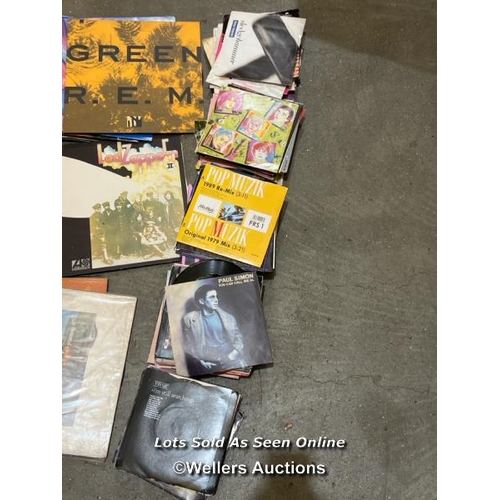 4 - Box full of vinyl records and singles, inc. The Beetles greatest hits, R.E.M, The Rolling Stones, Le... 