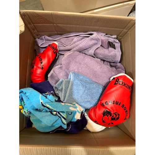 82 - Two boxes, one full of clothes, the other full of linen / Container no.  BM000508