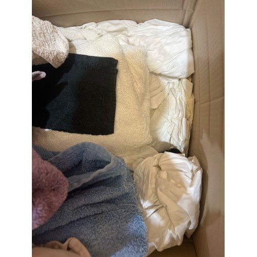 82 - Two boxes, one full of clothes, the other full of linen / Container no.  BM000508