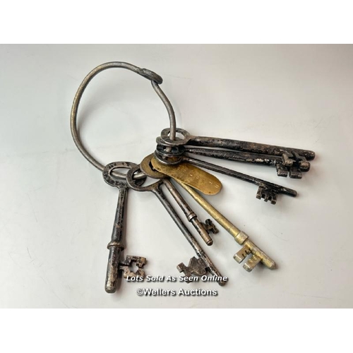 294 - This intriguing set of keys (eight in total), bearing a tag inscribed with the name 