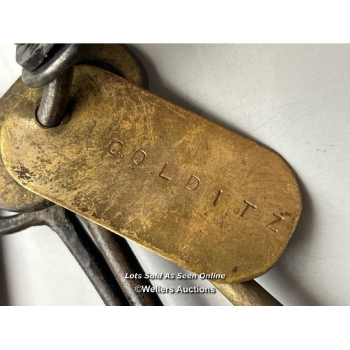 294 - This intriguing set of keys (eight in total), bearing a tag inscribed with the name 