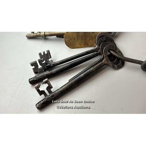 294 - This intriguing set of keys (eight in total), bearing a tag inscribed with the name 