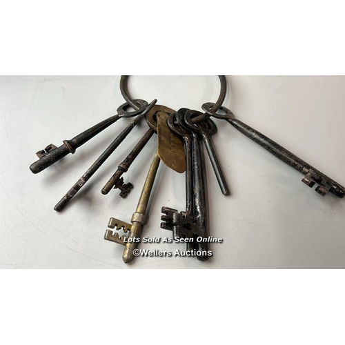 294 - This intriguing set of keys (eight in total), bearing a tag inscribed with the name 