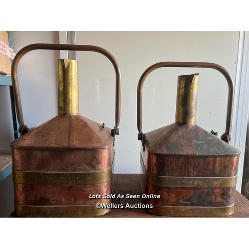 2116 - Set of two vintage copper and brass fuel measures, made by De Grave Short & Co for County of Berwick... 