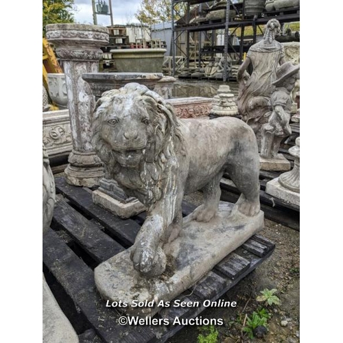 76 - L210 A pair of left and right facing reconstituted stone lions, 57cm h x 71cm l