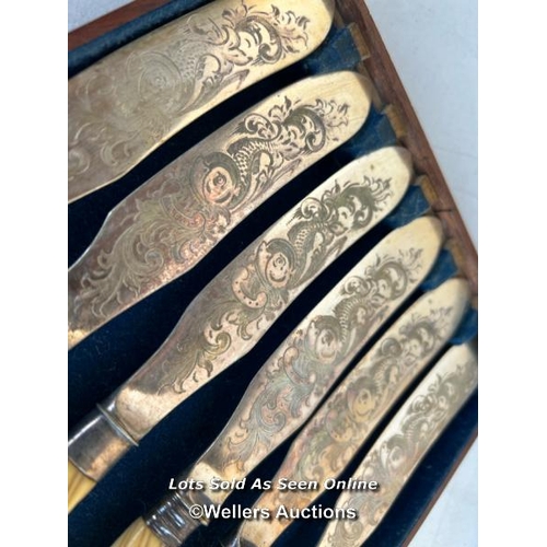 10 - A full set of twelve decorative fish knives with floral engravings to the blade, each knife approx. ... 