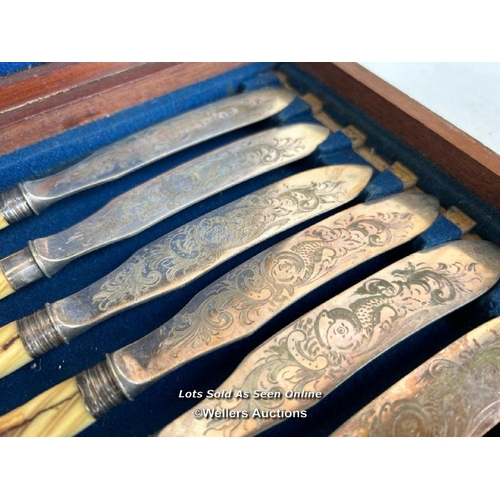 10 - A full set of twelve decorative fish knives with floral engravings to the blade, each knife approx. ... 