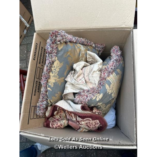 31 - A container of assorted linen, cushions, lamp shades, clothing and miscellaneous household items, si... 