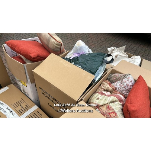 31 - A container of assorted linen, cushions, lamp shades, clothing and miscellaneous household items, si... 