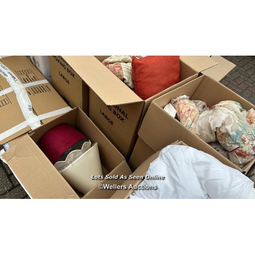 31 - A container of assorted linen, cushions, lamp shades, clothing and miscellaneous household items, si... 