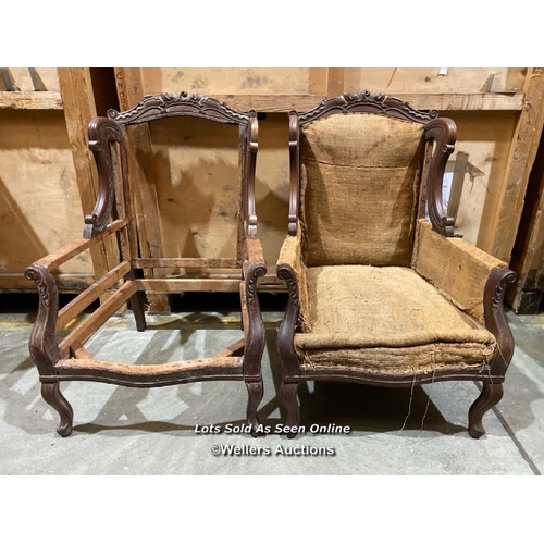 54 - A pair of ornately carved mahogony armchairs, originally an upholstery project, will require restora... 