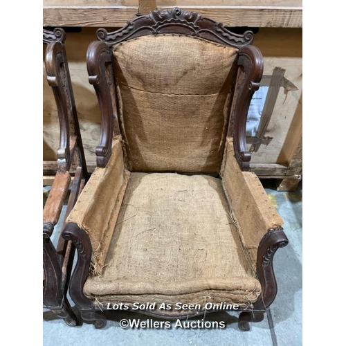 54 - A pair of ornately carved mahogony armchairs, originally an upholstery project, will require restora... 