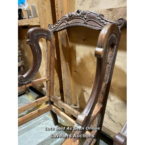 54 - A pair of ornately carved mahogony armchairs, originally an upholstery project, will require restora... 